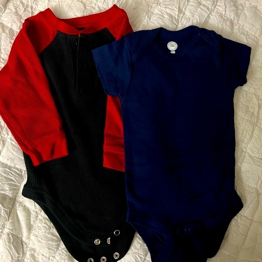 Onesies size 6-9m. One red and black and one short sleeve blue